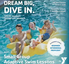 A group of young children sitting on a big yellow pool float together, the children are laughing & waving.