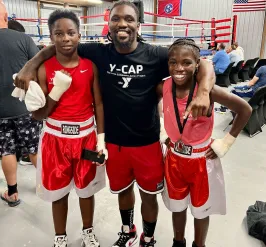 Boxing YCAP kids smiling with Roger